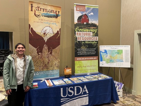 Kyle posing at the Society of American Indian Government Employees (SAIGE) National Training Program Career Fair. Part of work with the Natural Resources Conservation Service, was outreach events to prospective employees.